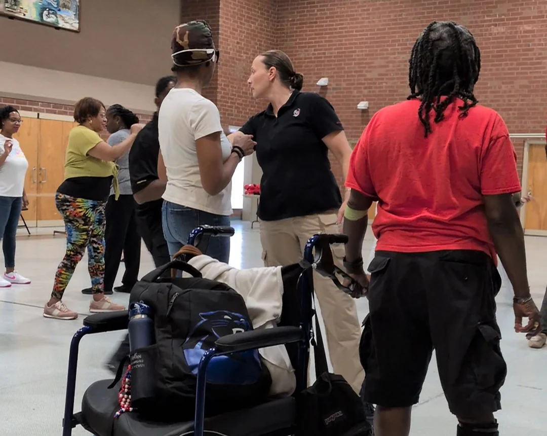 Carmen Gulliksen coaching participants at a hands-on Veterans Affairs training session
