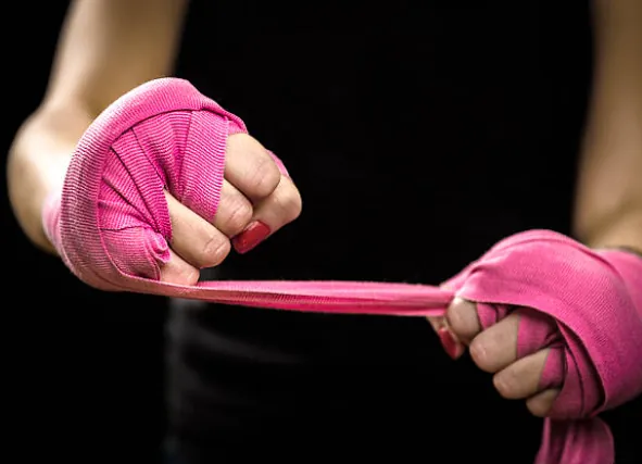 Hands being wrapped before a training session